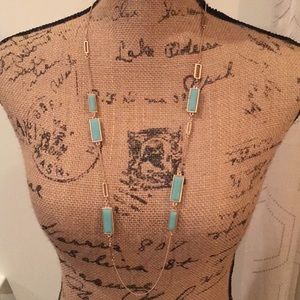 Gold and turquoise colored necklace